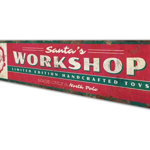 a sign that says santa's workshop on it