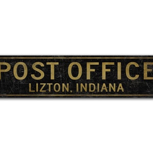 May include: Black and gold sign with the text "POST OFFICE" and "LIZTON, INDIANA" in gold lettering.
