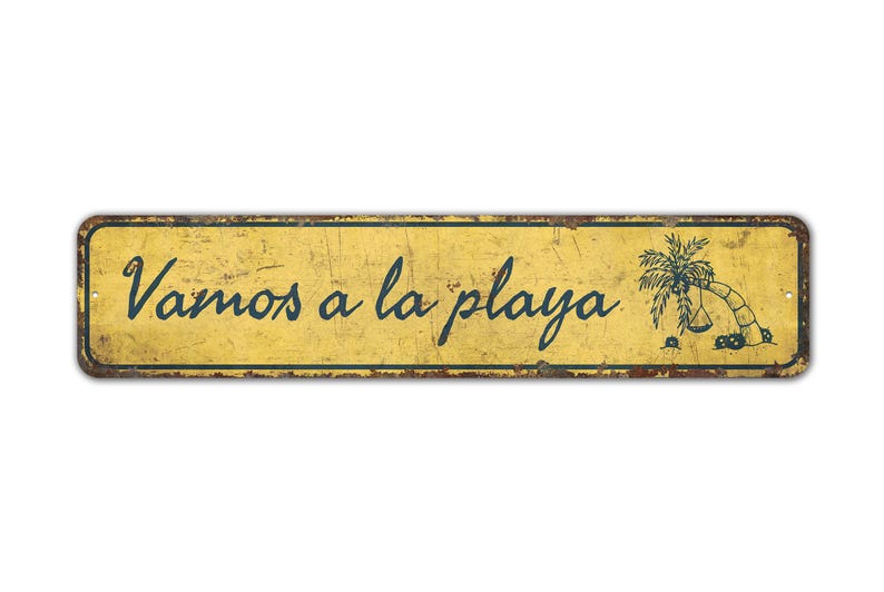 a yellow sign that says vamos a la playa