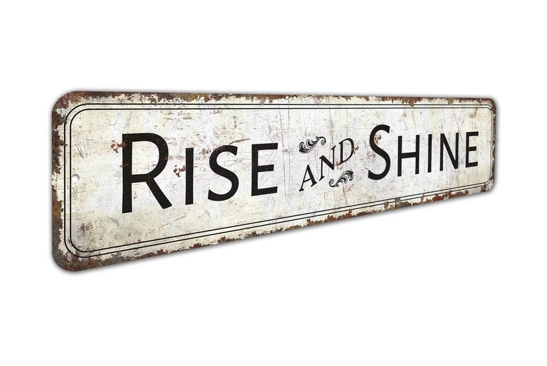 a rusted metal sign that says rise and shine