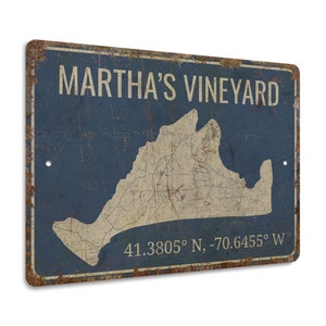 a metal sign with a map of martha's vineyard