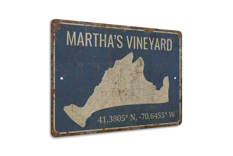 a metal sign with a map of martha's vineyard