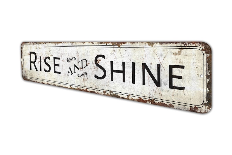a rusted metal sign that says rise and shine