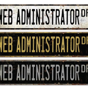 May include: Three vintage-style metal signs with the text "WEB ADMINISTRATOR DR" in black, gold, and silver lettering on a black background.