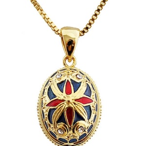 Blue Fabergé Egg Style Pendant "Butterflies" CZ Crystals and its Gold Plated chain.