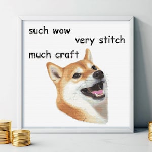 May include: A cross-stitch pattern featuring a Shiba Inu dog with the text "such wow very stitch much craft".