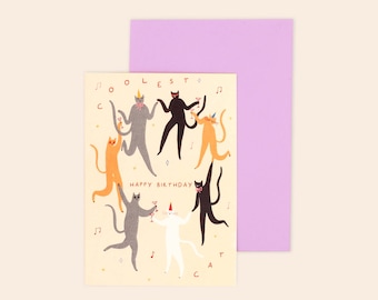 May include: A cream-colored greeting card featuring a group of dancing cats in various colors, including black, white, orange, and gray, some wearing party hats and holding cocktail glasses, with the text COOLEST CAT and HAPPY BIRTHDAY.