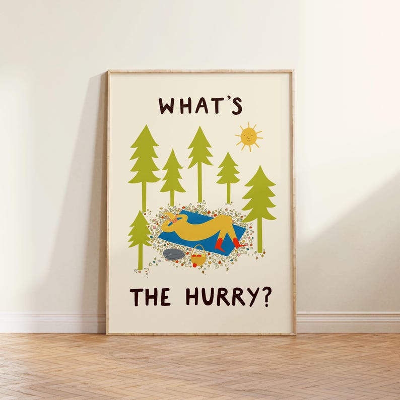 May include: A vertical wall art print on a cream background featuring the text WHAT'S THE HURRY? in dark brown. The illustration shows a yellow figure resting on a blue blanket in a forest of green pine trees with a yellow sun and a small basket.