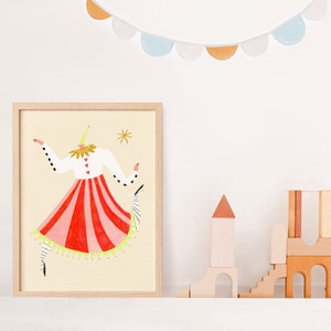 May include: A framed illustration of a stylized figure wearing a red and white striped skirt, a white shirt with black polka dots, and a yellow hat. The figure is dancing with one arm raised and the other arm extended to the side. The background is a light yellow.