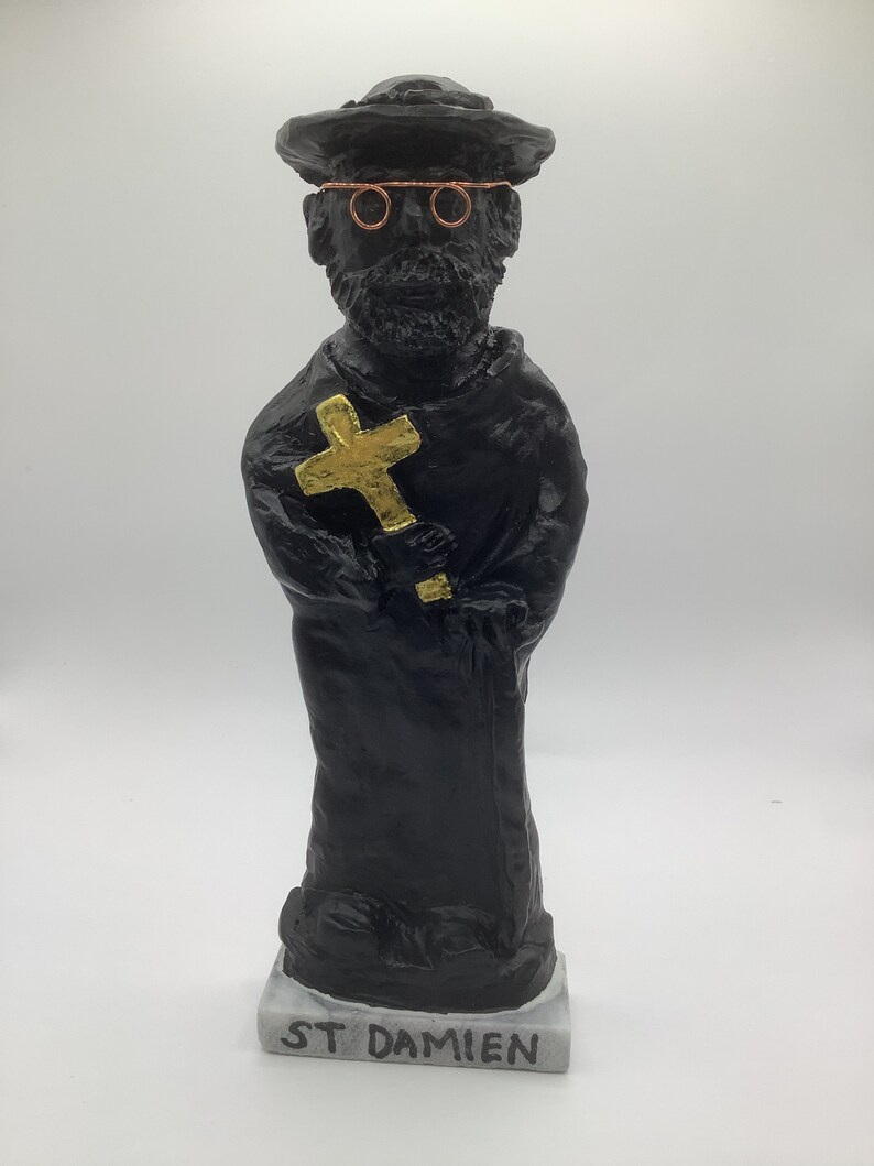 St Damien of Molokai Statue, Lava Rock Black W/ Golden Cross on a