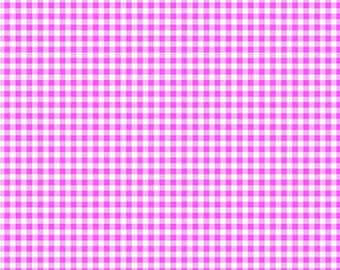 May include: A fabric featuring a bright pink and white gingham check pattern. A white ruler with black markings is visible at the bottom, showing a scale of 7 inches. The text "andover" and "www.andoverfabrics.com" is printed on the ruler.