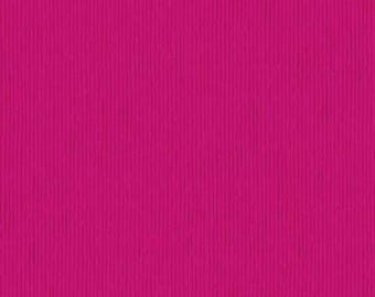 May include: A vibrant magenta colored material featuring a consistent vertical ribbed texture. The surface displays a series of parallel lines running from top to bottom, creating a uniform pattern across the entire field of the deep pink fabric.