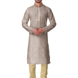 May include: A light grey kurta pajama set with a floral pattern. The kurta features a mandarin collar with gold embroidery and gold buttons. The matching pajama pants are a light beige color. The outfit is completed with black and gold embroidered shoes. The text "Grey-AN715" is in the top left corner.