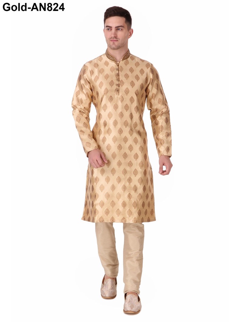 May include: A gold-colored kurta pajama set. The long-sleeved kurta features a repeating diamond pattern and a mandarin collar with gold embroidery. The matching pajama pants are a solid gold color. The text "Gold-AN824" is in the upper left corner.