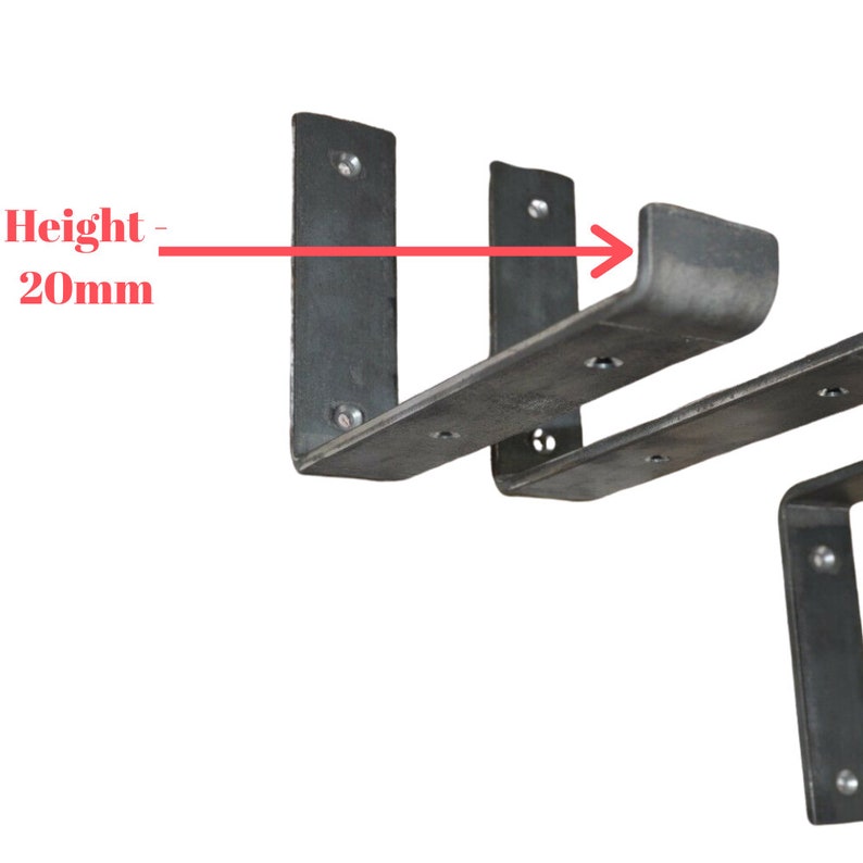 May include: Close-up of three dark gray metal shelf brackets. The brackets are made of thick metal and have a height of 20mm. Each bracket has pre-drilled holes for mounting. The brackets are designed to support shelves.