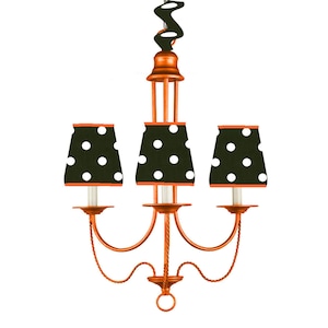 May include: A three-light chandelier with a copper finish. The lampshades are black with white polka dots and orange trim. The chandelier has a decorative, twisted cord design.