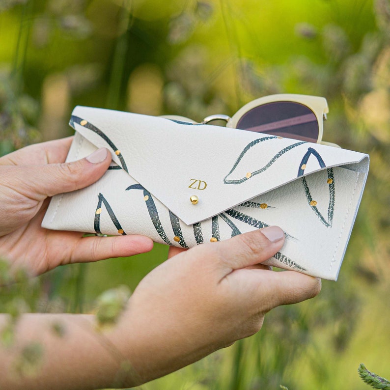 Personalised Botanical Leather Glasses Case in Dark Green and Gold. Sunglasses case made with recycled leather for summer. image 1