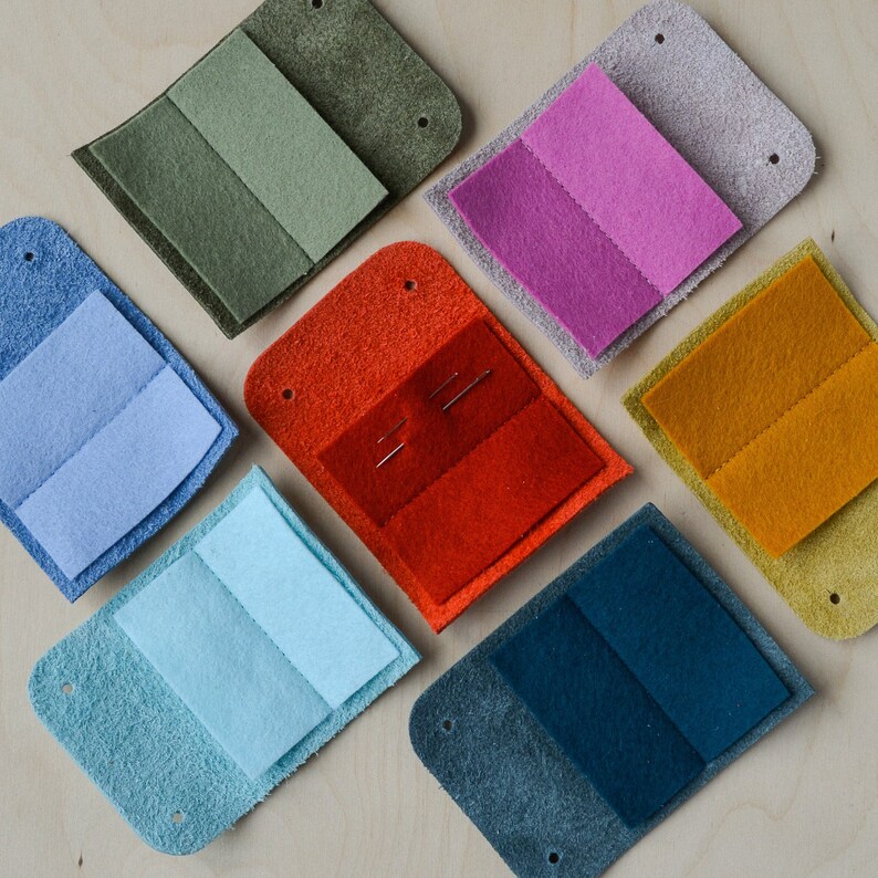 Sewing needle case in lots of colours include green, pink, yellow, red, blue, turquoise and navy.