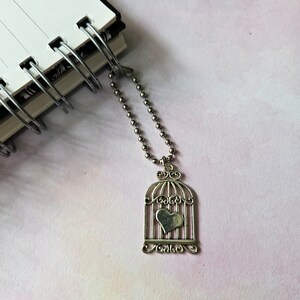 ciondolo planner gabbia per uccelli