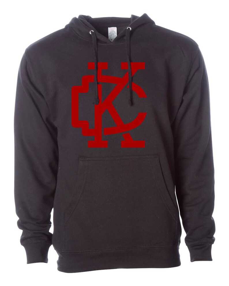 May include: Black hooded sweatshirt with a red "KC" logo on the front.