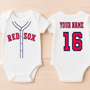 May include: White baby bodysuit with a baseball jersey design. The front features "RED SOX" in red lettering with navy blue trim, and a navy blue button-up design. The back has "YOUR NAME" and the number "16" in red with navy blue trim.