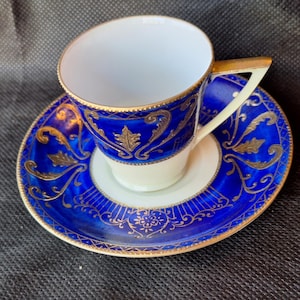 Vintage 1950s Ucago Hand painted Porcelain Blue and Gold Demitasse Cup Saucer Hand Painted Porcelain.  Made in Japan