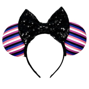 May include: Black sequined bow headband with pink, white, blue, and black striped mouse ears.