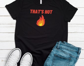 May include: Black t-shirt with the text "THAT'S HOT" in red and a red, orange, and yellow flame graphic.
