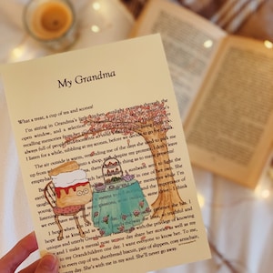 May include: A card featuring a hand-drawn illustration of a cat enjoying a cup of tea and scones. The card has the text "My Grandma" and a poem about the importance of family and memories.