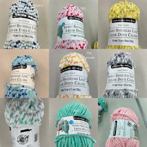 May include: A collection of ten yarn skeins in various colours and patterns, including nautical, taffy, lemon, wave, rhino, glacier, mint, and pink. Each skein is labelled "Sweet Snuggles Lite Leger Doux Calins" and includes the yardage and weight.