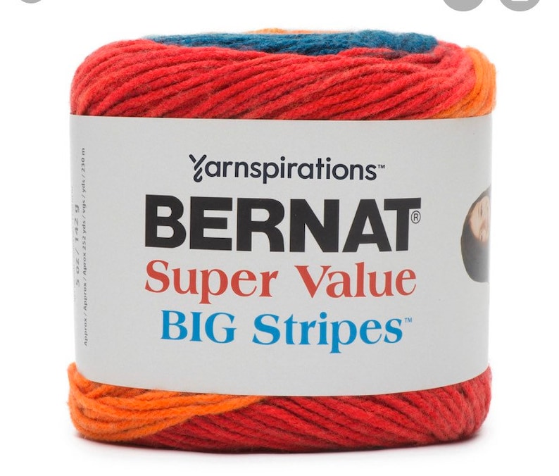 May include: A ball of Bernat Super Value Big Stripes yarn in a red, orange, and blue color scheme. The yarn is made by Yarnspirations.