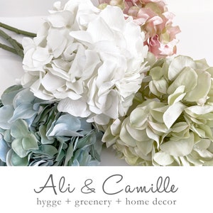 Hydrangeas; 4 soft pastel artificial hydrangeas, gentle hues for timeless elegance. Sold individually.