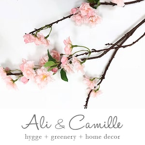 Cherry blossom, lifelike 39&quot; long flowering branch of artificial cherry blossoms in soft pink or white. Crafted to mimic nature&#39;s beauty.