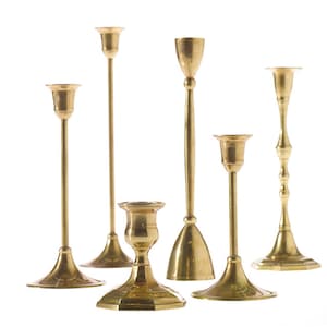 Brass candlestick holders, sold individually in varying sizes. Elevate your ambiance with these timeless brass candlesticks
