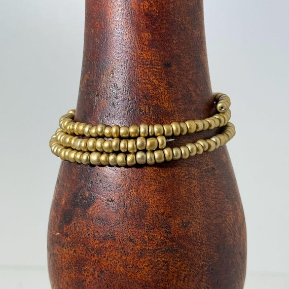 Memory wire wrap bracelet with gold color beads