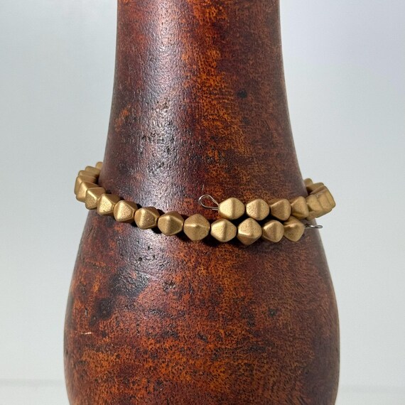 Memory wire wrap bracelet with gold colored beads