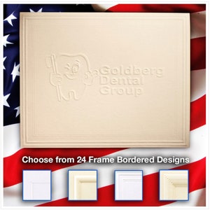 May include: A beige card with a raised embossed image of a smiling tooth holding a toothbrush. The text "Goldberg Dental Group" is embossed below the tooth. The card has a decorative border. The text "Choose from 24 Frame Bordered Designs" is below the card. Four white frames with different border designs are shown below the text.