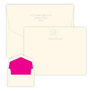 May include: A set of ivory stationery with a pink envelope. The stationery features a monogram with the initials "AR" in a script font. The return address on the envelope reads "5412 Cambridge Drive, Dallas, Texas 75207".