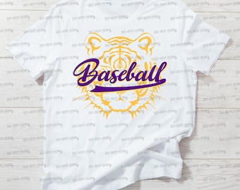 May include: White t-shirt with a yellow tiger head graphic and the word "Baseball" in purple lettering.