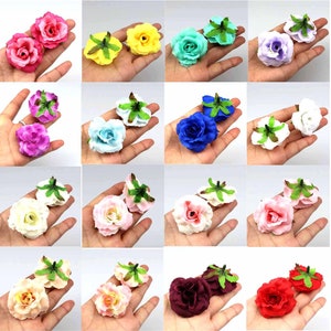 May include: Assortment of artificial flower heads in various colors, including pink, red, blue, white, and yellow. Each flower head is made of fabric and has a green stem with leaves.