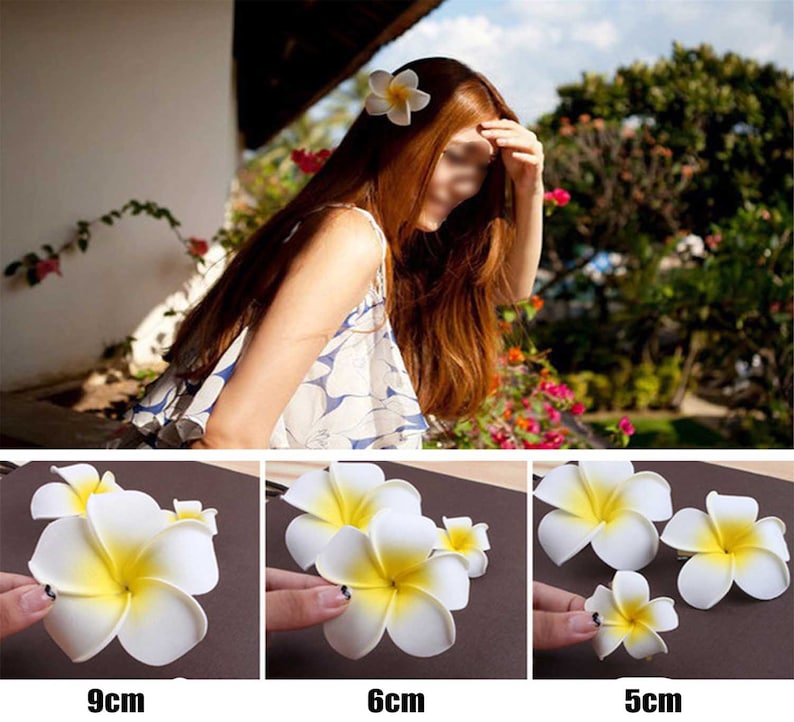May include: Three white and yellow plumeria flower hair clips in different sizes: 9 cm, 6 cm, and 5 cm.