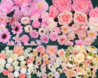 May include: A collection of pink and white silk flower arrangements. The flowers are arranged in a variety of styles, including roses, carnations, and lilies. The flowers are all in full bloom and have a delicate, feminine look.
