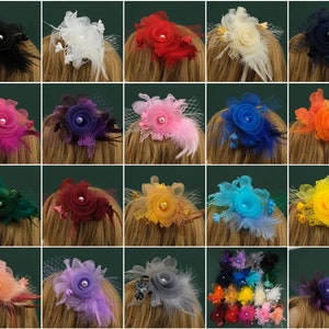 May include: Assortment of 20 hair clips with various coloured fabric flowers. Each clip features a single flower with a pearl centre and a net veil. The flowers are in shades of red, pink, blue, green, yellow, orange, purple, and black.