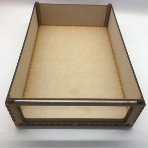 May include: A wooden box with a clear plastic window on the front. The box is made of unfinished wood and has a natural brown color.