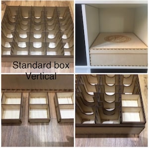 May include: A wooden box with a removable insert for organizing game pieces. The insert has multiple compartments of different sizes. The box is labeled "Standard box Vertical".