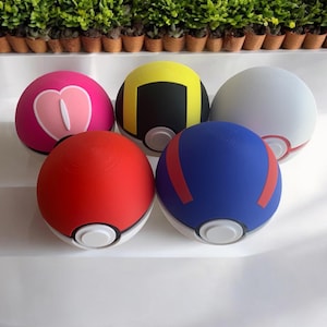 3D Printed Pokeball style deck box. Various options available. Token holder