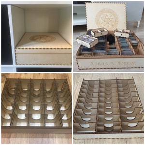 May include: A wooden box with a pentagram design on the lid and the words "Arkham Horror" on the front. The box is open and contains multiple compartments for organizing game pieces.