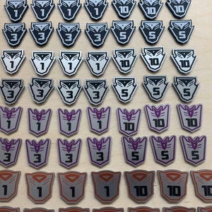 Transformers card game compatible large premium token set. Full colour, embossed, double sided - no painting required.