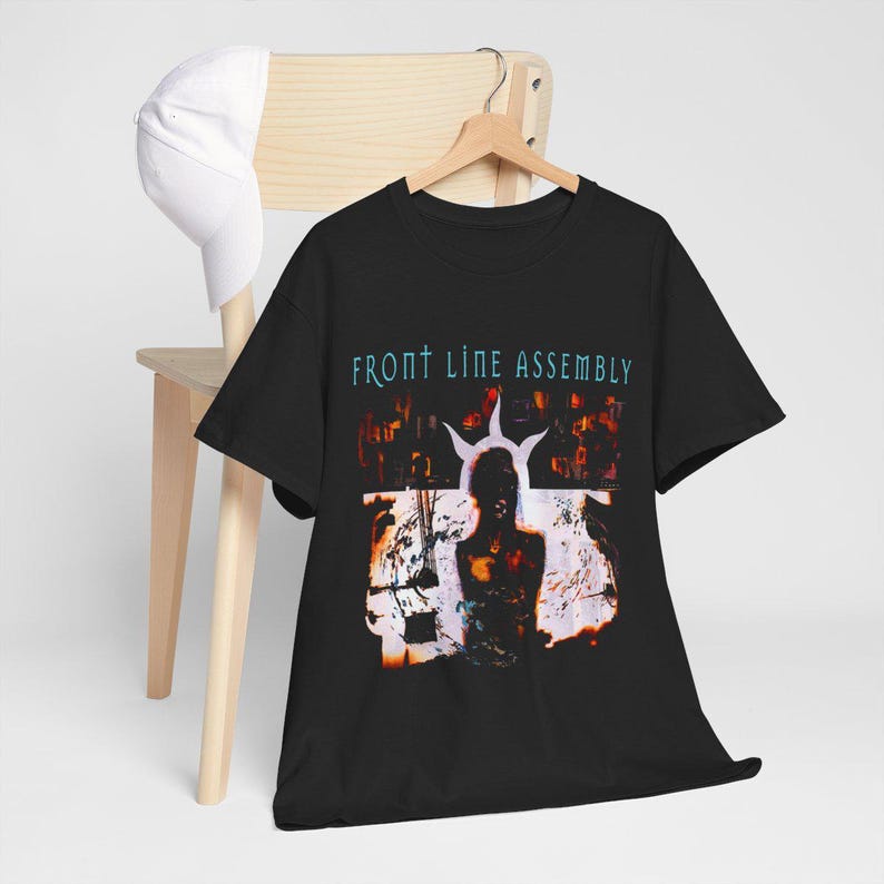 May include: Black t-shirt with a graphic print of a person with a crown of thorns and the text "Front Line Assembly".