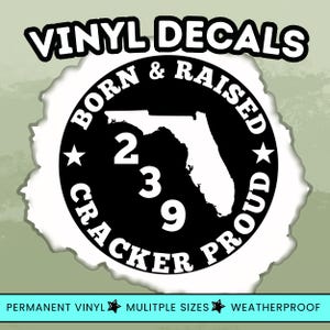 May include: Black and white vinyl decal with the text "VINYL DECALS" at the top. The design features a circular emblem with the words "BORN & RAISED CRACKER PROUD" around the outline of Florida, with the numbers "239" in the center.
